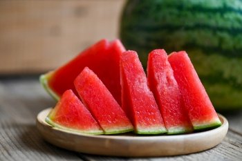 Watermelon slice on plate wooden background, Closeup sweet watermelon slices pieces fresh watermelon tropical summer fruit