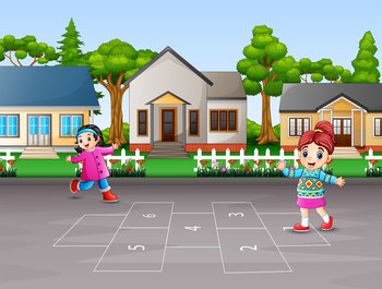 Happy children playing hopscotch in the yard	
