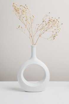 dry flower in vase, nordic vase ceramic in beige background