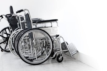 Wheelchair, a chair with wheels for disability people and hospital illness injury patient care.