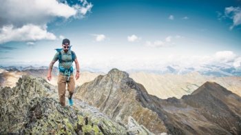 Man on alpine ridges in the mountains of northern Italy