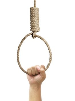 Hand holding rope noose with hangman’s knot hanging on white background