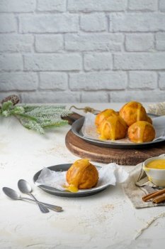 Rabanadas poveiras with egg cream and cinnamon on a kitchen countertop during the Christmas season.
