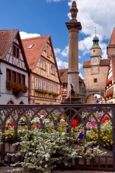 Facades of old medieval houses in the historical part of the city. Rothenburg ob der Tauber on a sunny day. Bavaria Germany.. Rothenburg ob der Tauber. The old famous medieval town on a sunny day.