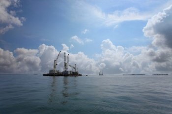 Marine cranes are used for loading and unloading cargo onto ships, The transportation and distribution center of Koh Sichang in Thailand.