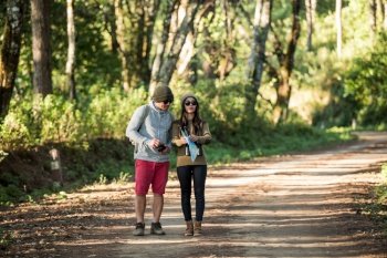 Young couple tourist travel in mountain forest