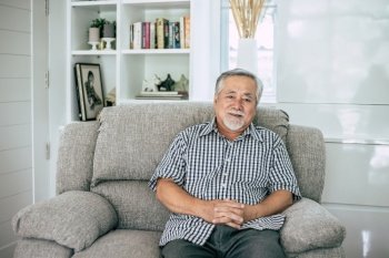 Portrait of Senior Man sitting and smiling