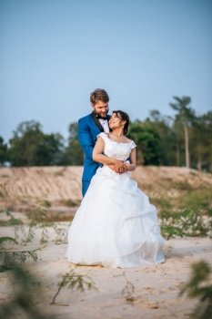 Asian bride and Caucasian groom have romance time and happy together 