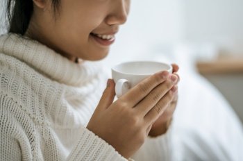 One woman held a cup of coffee and smiled happily.