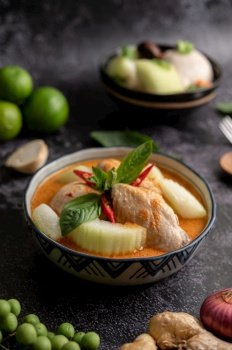 Chicken curry with winter melon, with mushroom, garlic, chilli and basil.