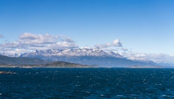 Range of mountains on the island opposite city of Ushuaia in Argentina on Beagle Channel. Snow capped mountains in Beagle Channel by Ushuaia