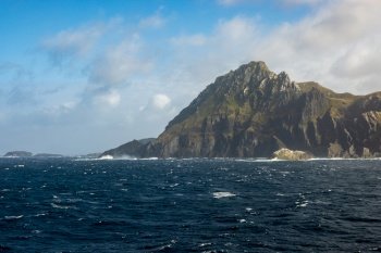 Rocky cliffs form Cape Horn on Hornos Island in Chile. Jagged cliff face at Cape Horn on Hornos Island in Chile