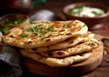 Naan flatbread with herbs and dip on chopping board.AI Generative