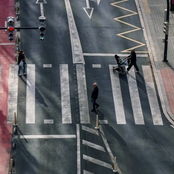                                  pedestrian crossing the crosswalk in Bilbao city, Basque country, Spain