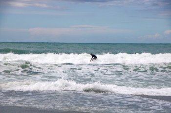 At Levanto - On March, 31, 2018 , Surfers at Levanto   with wavy sea  in five lands park of Liguria in Italy