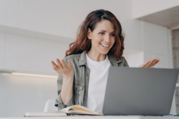 Excited woman sitting at laptop surprised by good news. Overjoyed, stunned female working on computer gets unexpected email, found solution, came up with idea. Insight, amazement emotion.. Happy woman working at laptop, surprised by good news email, came up with idea. Insight, amazement