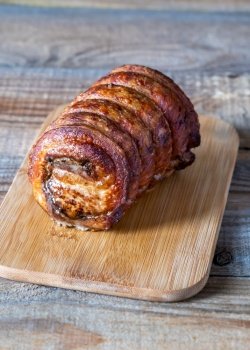 Slow roast rolled pork on the cutting board