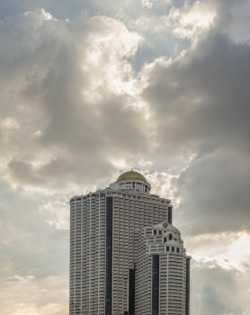Bangkok, Thailand - 11 Nov 2022 : Architectural exterior view of modern high-rise building against the background of the sky with clouds. Space for text, Selective focus.