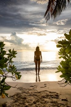 woman relaxing on beautiful tropical beach