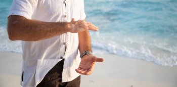 man practicing qigong by the sea