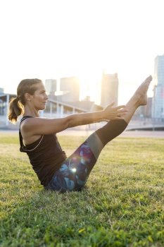 Beautiful girl is engaged in yoga in the park