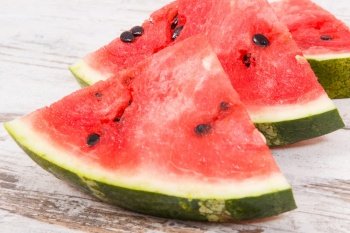 Slice of fresh watermelon, concept of healthy delicious and juicy dessert. Slice of watermelon, concept of healthy delicious dessert