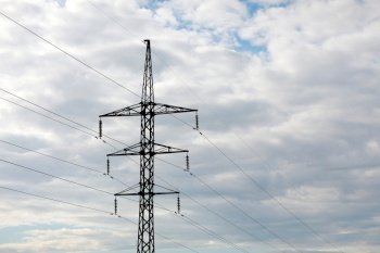 high-voltage power lines on blue sky background. electricity distribution station. Electrical net of poles on a panorama. power tower. high-voltage power lines on blue sky background. electricity distribution station. Electrical net of poles on a panorama. power tower.