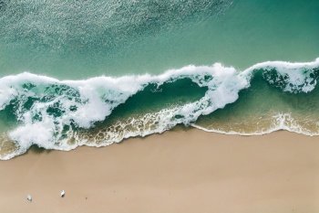 Spectacular top view from drone photo of beautiful beach with relaxing sunlight, sea water waves pounding the sand at the shore. Calmness and refreshing beach scenery.. Spectacular drone photo of beach for refreshing and calmness concept.