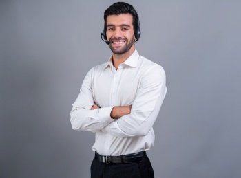 Male call center operator wearing headset and formal suit standing confidently on isolated background portrait. Professional smile and service minded for customer service and support. fervent. Male call center operator wearing headset and formal suit portrait. fervent