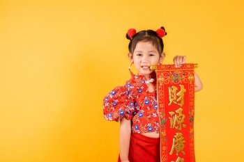 Chinese New Year. Happy Asian Chinese little child girl smile wearing red cheongsam qipao Spring festival couplets (Character 