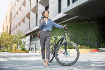 Asian beautiful young woman use smart mobile phone talk with business during go to office work at city street with bicycle, Happy lifestyle business female commuting outside in morning, Eco friendly