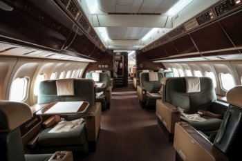 The sleek and modern interior of a business class airplane cabin, with plush seats and personalized amenities AI Generative.
