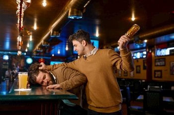 Soccer fans fighting at sport bar. Angry mad guy holding glass beer bottle attacks friend. Emotional people conflict at pub. Soccer fans fighting at sport bar, guy attacks friend