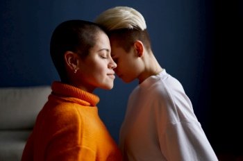 Romantic young lesbian girlfriend side view closeup sensual portrait. Lgbt relationship, self-acceptance and female rights concept. Romantic young lesbian girlfriend side view closeup sensual portrait