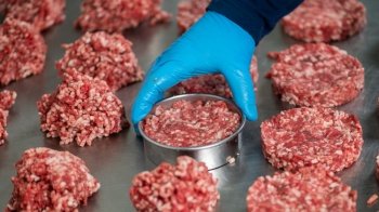 Making burger patties using ring mold in a commercial kitchen