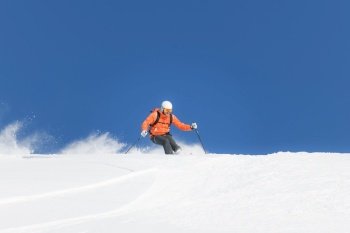 White fresh virgin snow during ski touring descent