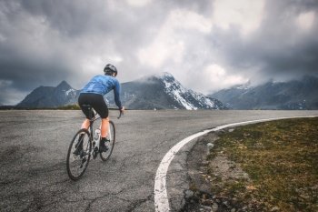 Ascent by bicycle to an alpine pass in the Lombardy pre-Alps in Italy