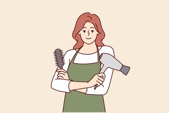 Woman professional hairdresser from barbershop holding comb and hair dryer to care for client hairstyle. Girl working as hairdresser in beauty salon stands with arms crossed and looks at camera. Woman hairdresser from barbershop holding comb and hair dryer to care for client hairstyle
