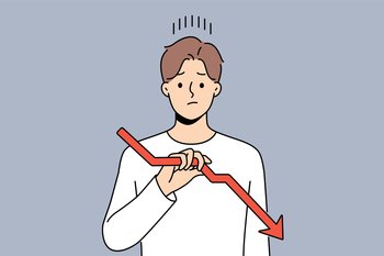 Sad man holds declining chart symbolizing beginning of crisis and financial recession affecting income. Upset guy with red down arrow reports decrease in number of clients or decrease in wages. Sad man holds declining chart symbolizing beginning crisis and financial recession affecting income