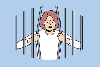 Woman prisoner breaks bars wanting to be released from captivity, for concept fight against discrimination and restrictions. Girl prisoner trying to escape from prison to avoid punishment for crimes. Woman breaks bars wanting to be released from captivity, for concept fight against restrictions