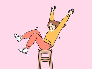 Happy girl is spinning on wooden chair, raising hands up and sharing good mood with others. Positive teenager girl in stylish clothes enjoys life without wanting to pay attention to troubles. Happy girl is spinning on wooden chair, raising hands up and sharing good mood with others
