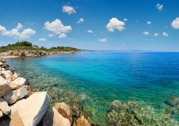 Summer Sithonia coastline and Aegean sea scenery with beach and house (Lagonisi, Halkidiki, Greece). Panorama.