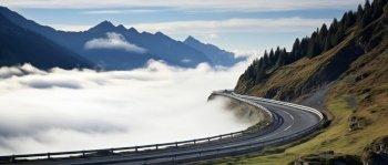Serpentine mountain road in front of a cloud of fog