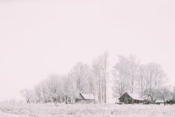 Landscape With Old Wooden Houses At Snowy Winter Frosty Day.