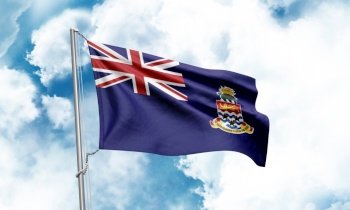 Cayman Islands flag waving on sky background. 3D Rendering
