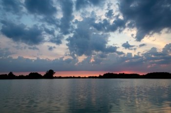 Evening clouds over the water after sunset, Stankow, Poland