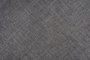 Jacquard woven upholstery, gray coarse fabric texture with diagonal weave lines. Textile background, furniture textile material, wallpaper, backdrop. Cloth structure close up.