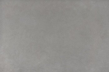 Texture background of gray velours fabric textured like leather surface. Fabric texture close up of upholstery furniture textile material, design interior, wall decor, backdrop, wallpaper.
