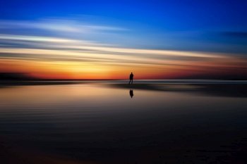 beach person silhouette sunset