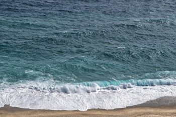 beach sand waves foam ocean sea